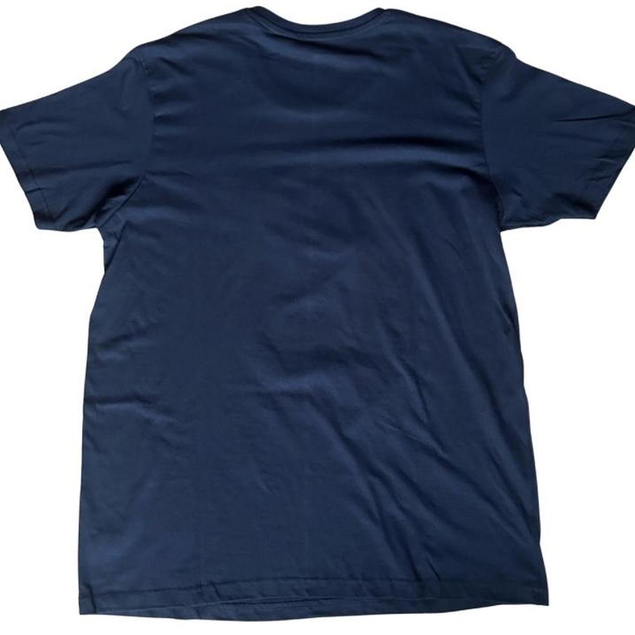 Tim Burton’s Corpse Bride graphic tee featuring Victor and Emily under the moonlit blue scene