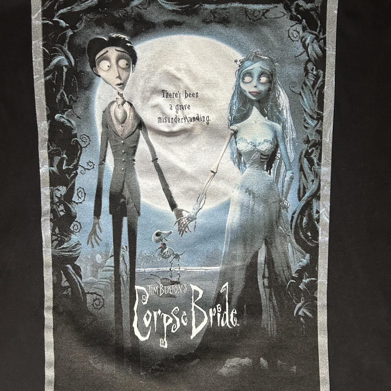 Tim Burton’s Corpse Bride graphic tee featuring Victor and Emily under the moonlit blue scene