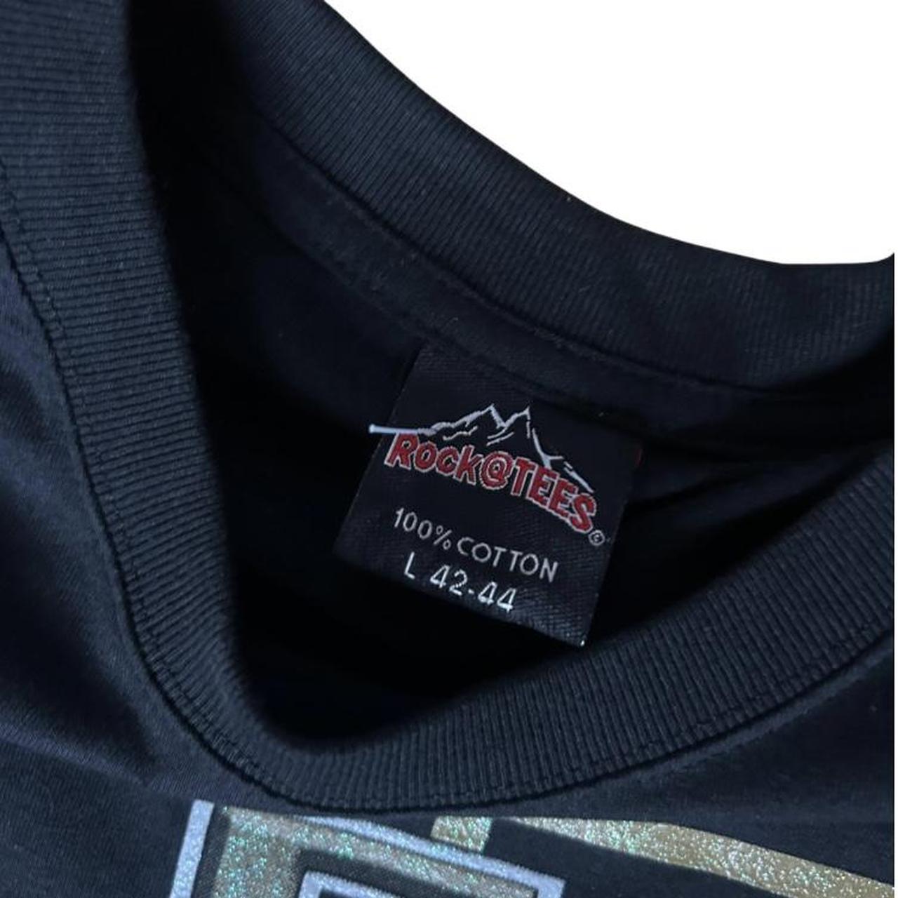 Elvis Presley graphic tee featuring four classic portrait prints on the front with bold ELVIS letter