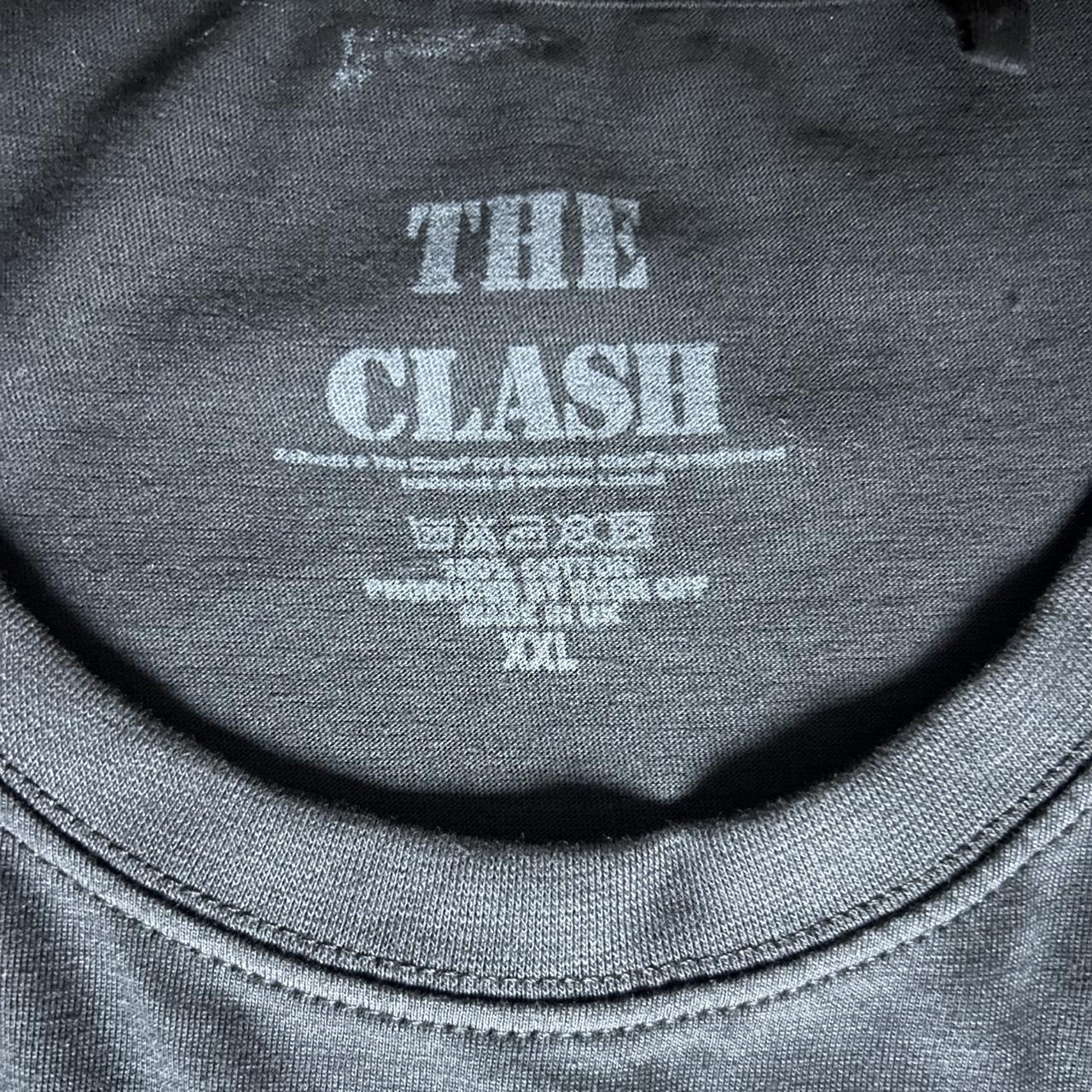 The Clash “London Calling” graphic tee featuring the iconic bass smash artwork with the pink and gre
